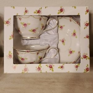 Set of rose teacups and saucers